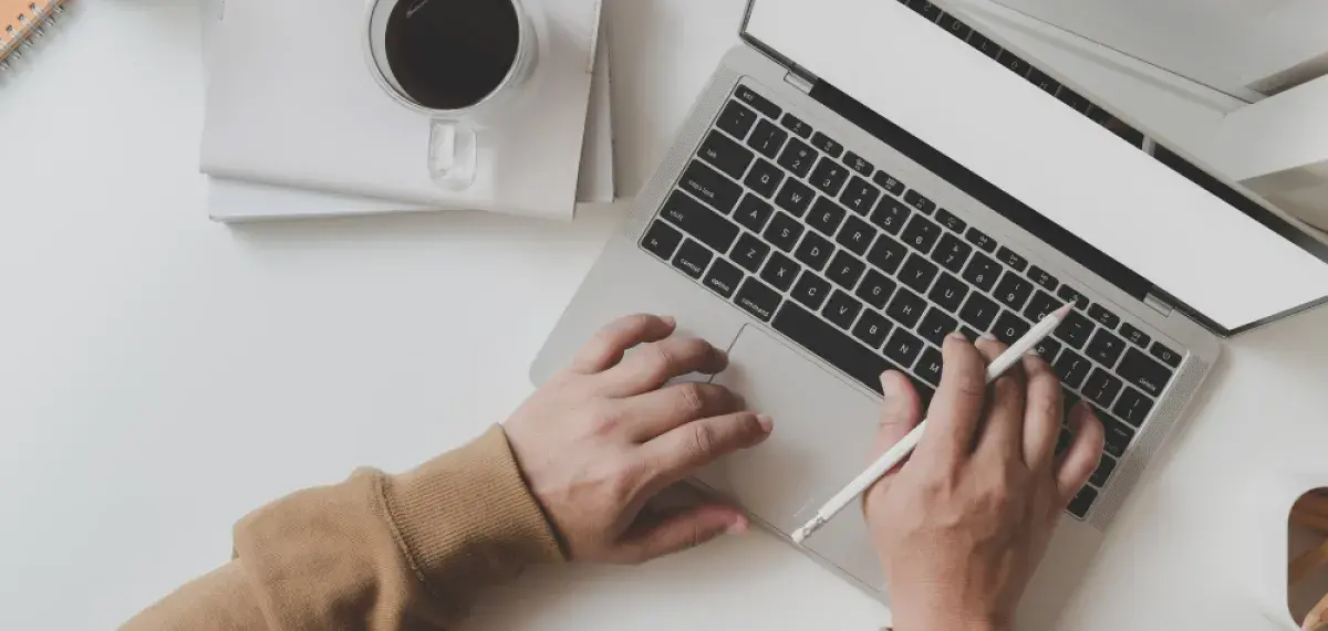 Hands on laptop keyboard
