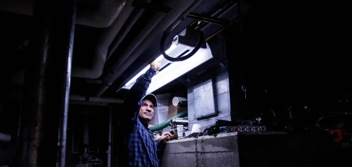 Man replacing lightbulb